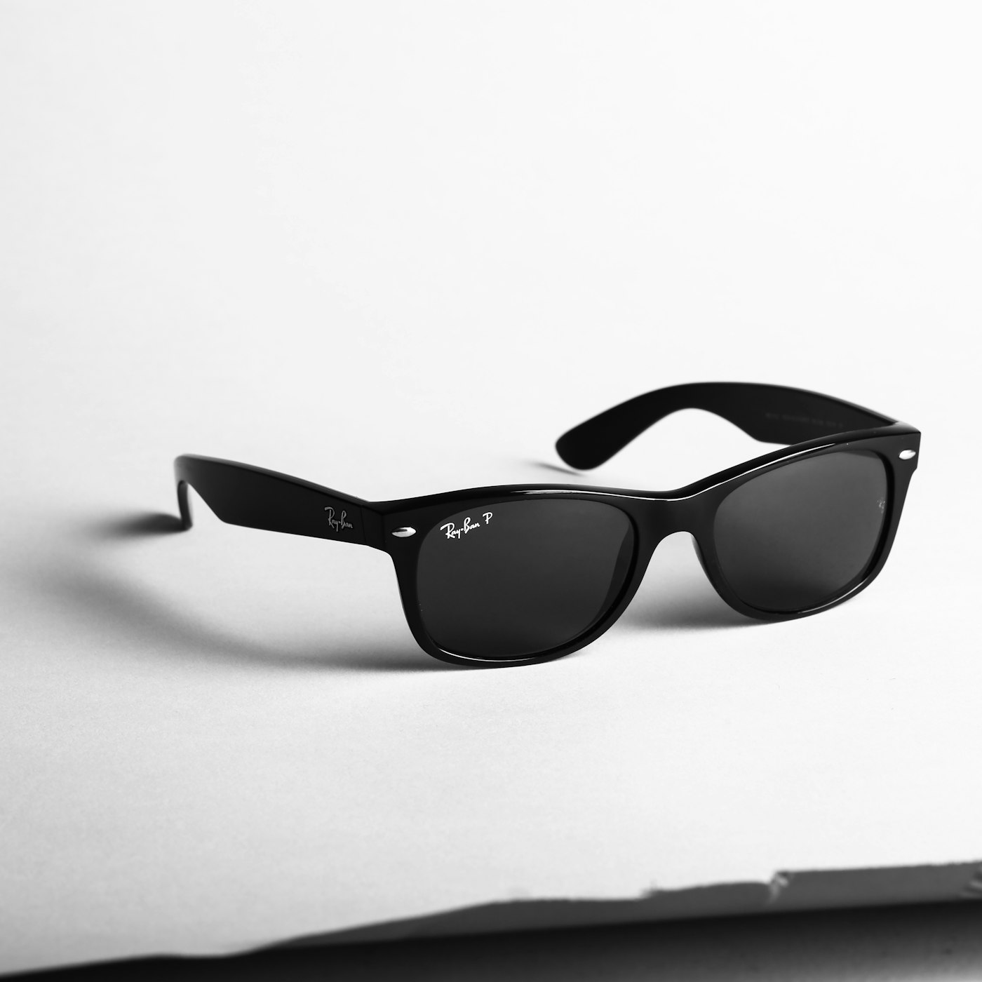 Sunglasses product on a bright surface